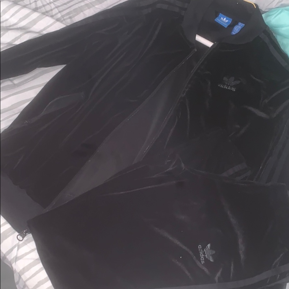 Women’s adidas sude joggin suit .